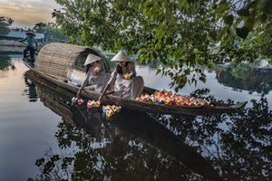 Two Vietnamese girls light lotus