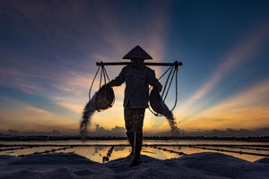 The first sunrays reflection on the the salt pool of Hon Khoi