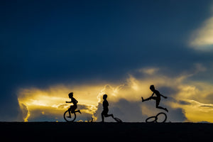 Children play with joy in the first light of dawn.