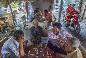 A daily routing meeting of neighbors in one of Bac Lieu's alleys