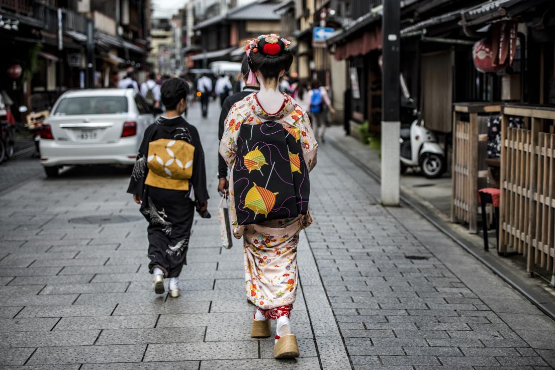 Maiko going to work on the streets of Kyoto