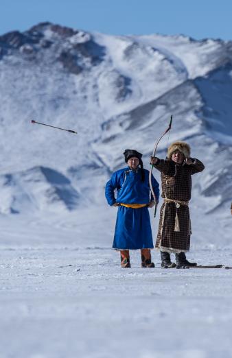 Archery shooting training on a frozen ice lake