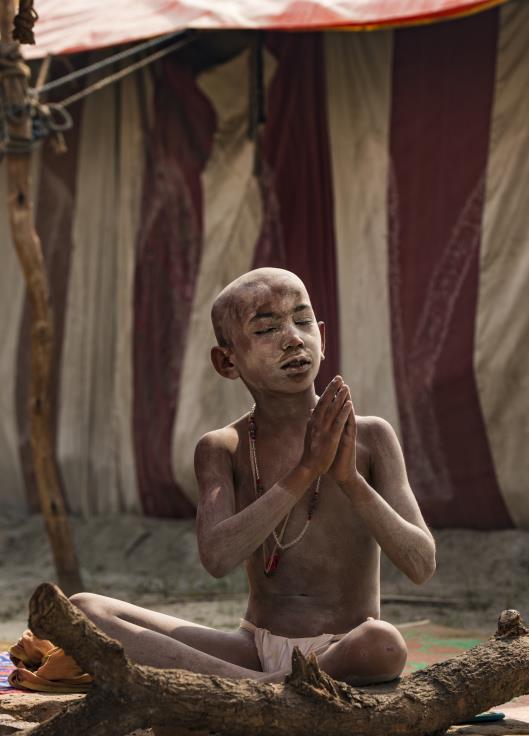 A young Hindu believer meditating